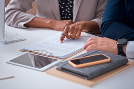 people reviewing a document in an office